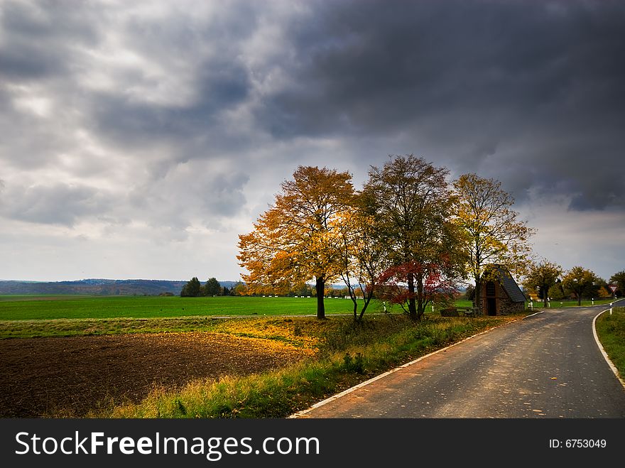 A road through an autumn landscape in germany