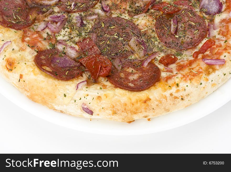 A pizza on a white plate over light grey background