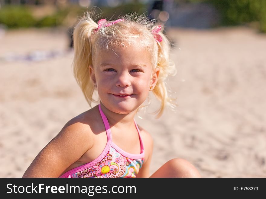 Young Blond Girl At The Beach