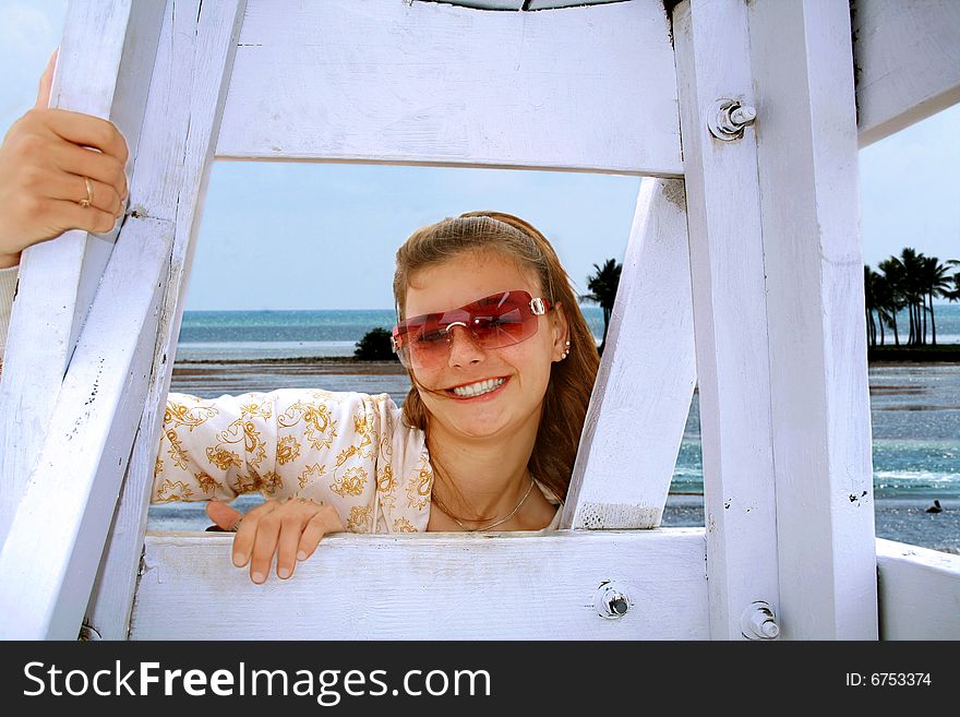 Attractive teenage girl enjoying the breeze at the ocean. Attractive teenage girl enjoying the breeze at the ocean