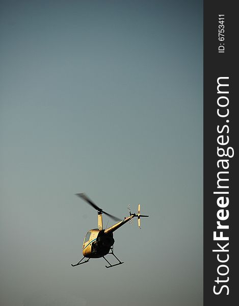 Chopper flying in the blue sky of italy. Chopper flying in the blue sky of italy