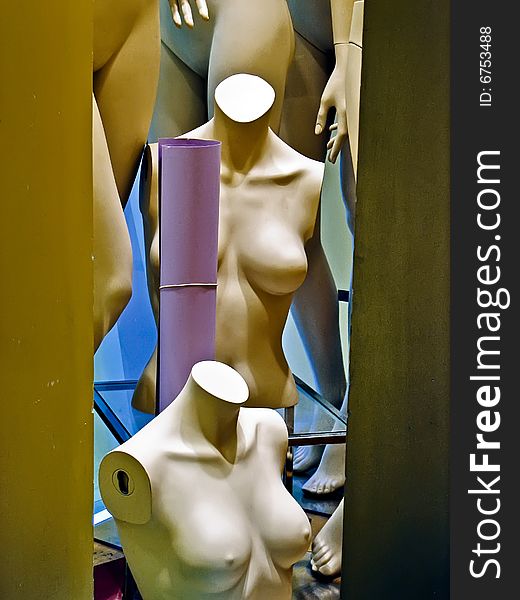 Naked mannequins in a shop window