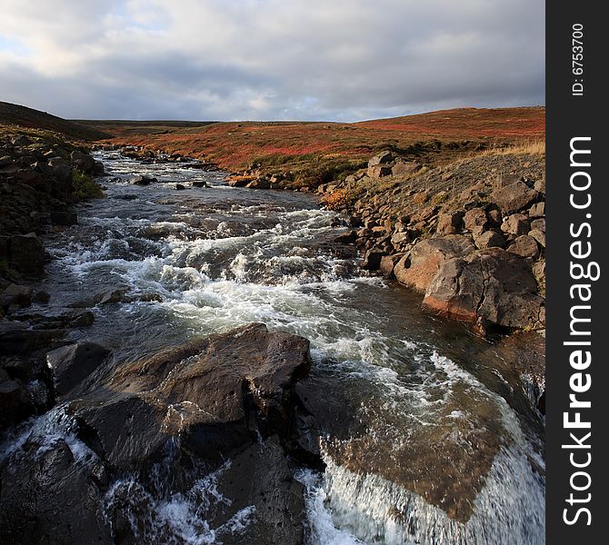 Landscape with fast river in Iceland