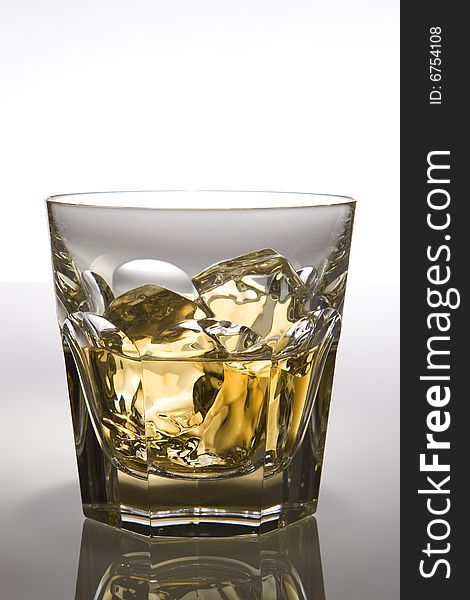 Image of a fine glass with whiskey on the rocks