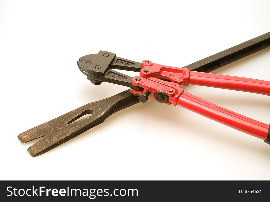 New red bolt cutters and old prybar. New red bolt cutters and old prybar