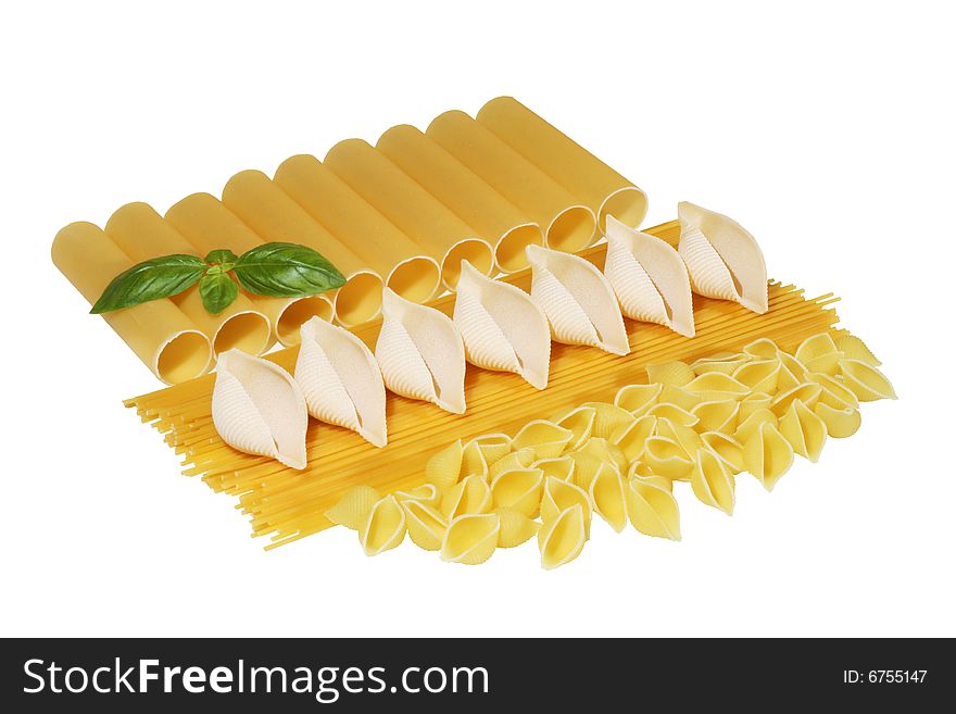 Spaghetti and conchiglie with basil isolated on white background