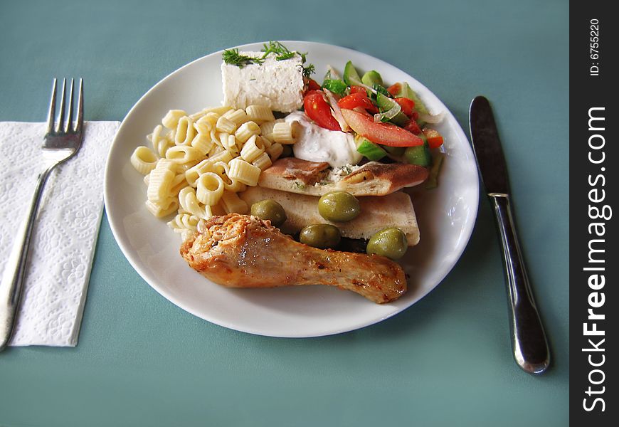 Fried chiken with vegetables, cheese and pasta. Fried chiken with vegetables, cheese and pasta