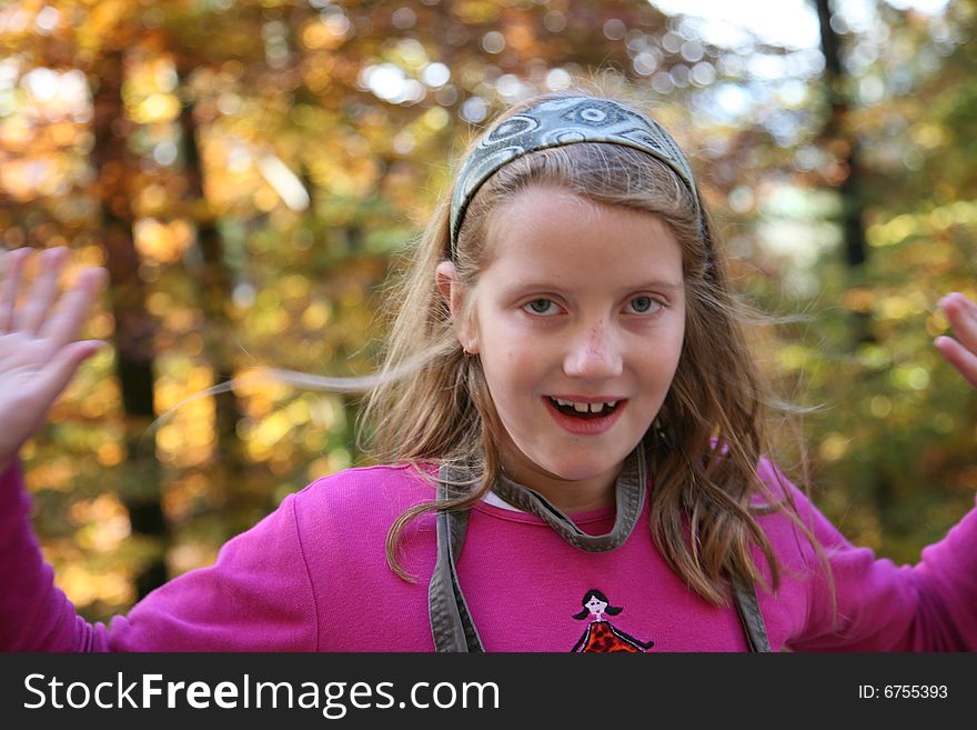 Happy girl in the autumn forest with colourful leaves. Happy girl in the autumn forest with colourful leaves