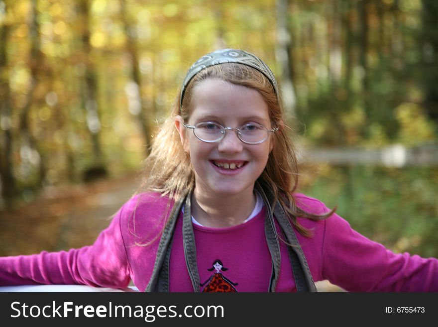 Happy girl in the autumn forest with colourful leaves. Happy girl in the autumn forest with colourful leaves