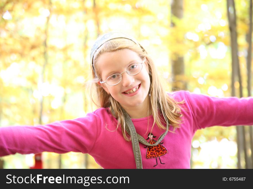 Happy girl in the autumn forest with colourful leaves. Happy girl in the autumn forest with colourful leaves