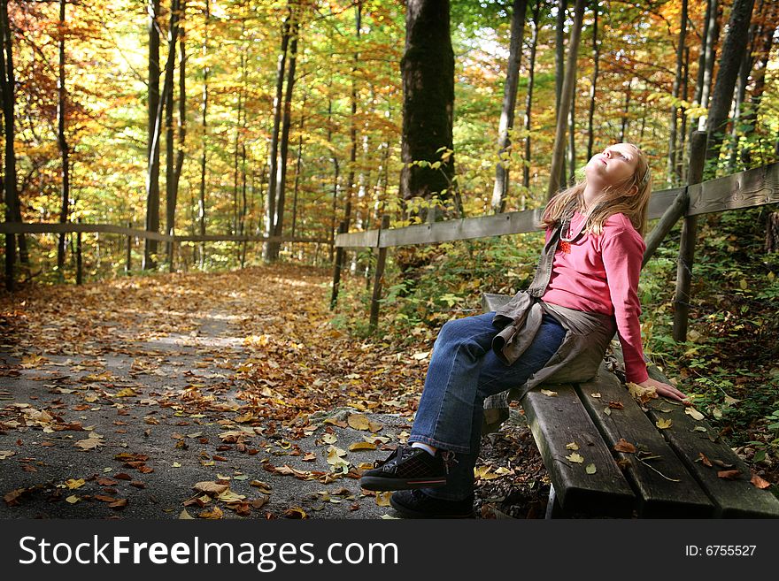 Happy girl in the autumn forest with colourful leaves. Happy girl in the autumn forest with colourful leaves