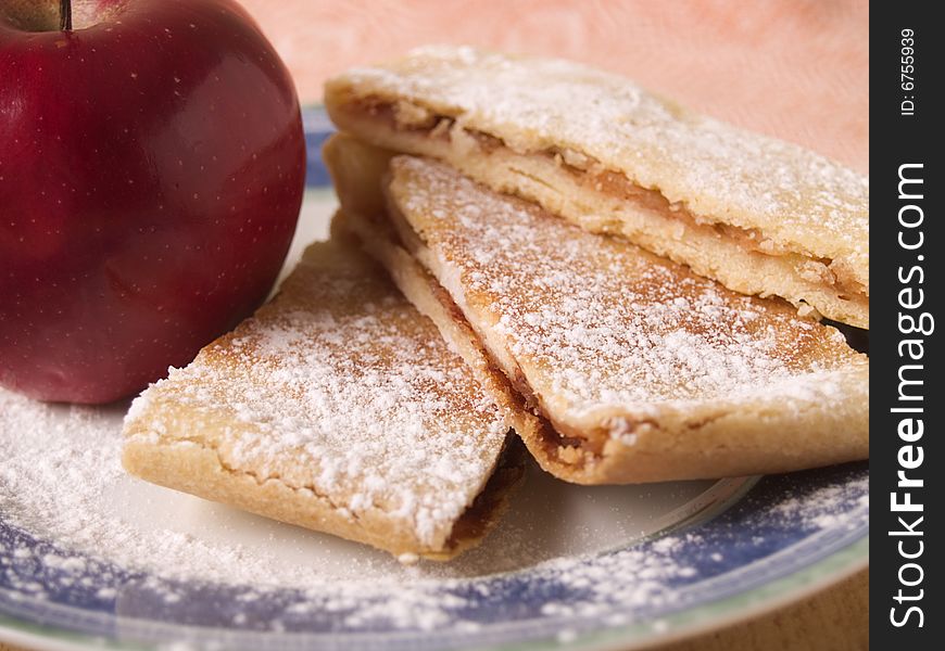 Cake and apple on the roll. Cake and apple on the roll