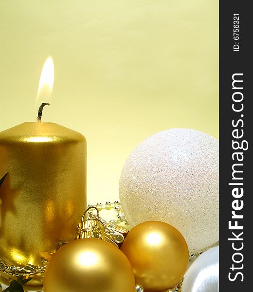 Christmas arrangement with gold candle and balls. Christmas arrangement with gold candle and balls