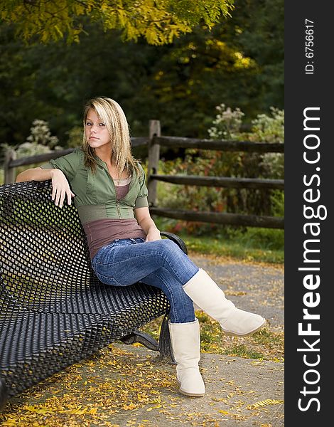 A beautiful blond teenage girl in the park. A beautiful blond teenage girl in the park