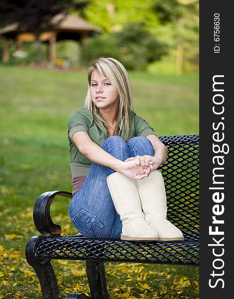 A beautiful blond teenage girl in the park. A beautiful blond teenage girl in the park