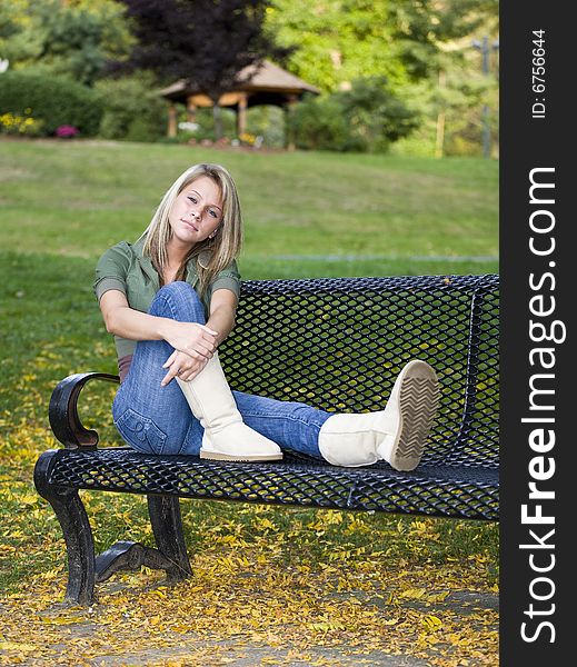 A beautiful blond teenage girl in the park. A beautiful blond teenage girl in the park