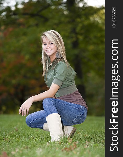 A beautiful blond teenage girl in the park. A beautiful blond teenage girl in the park