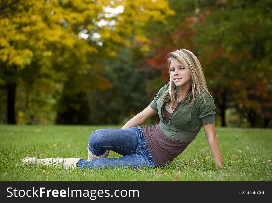 A beautiful blond teenage girl in the park. A beautiful blond teenage girl in the park