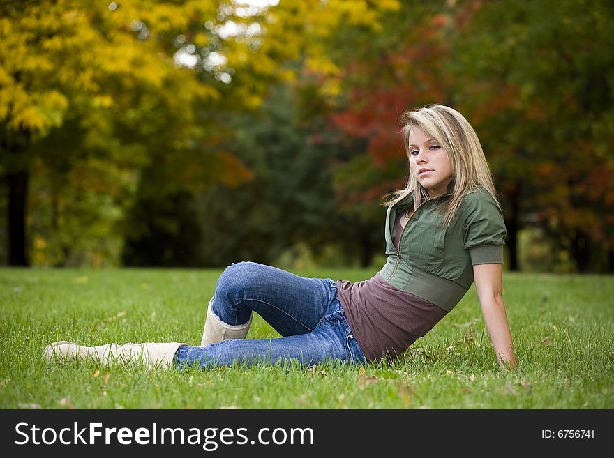 A beautiful blond teenage girl in the park. A beautiful blond teenage girl in the park