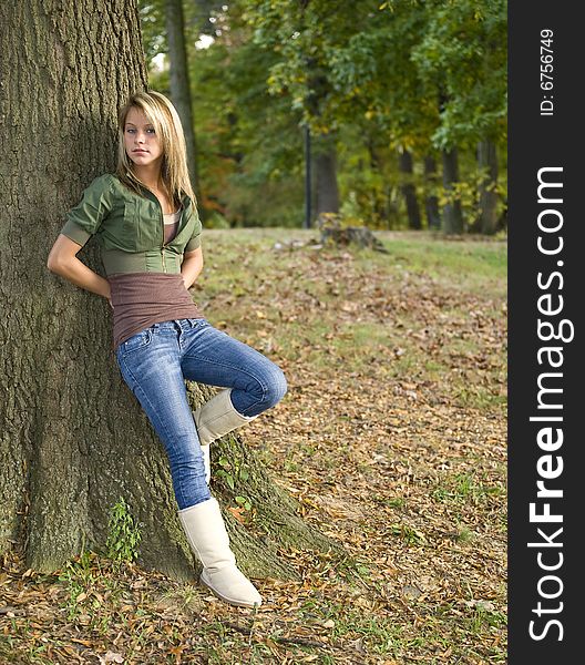 A beautiful blond teenage girl in the park. A beautiful blond teenage girl in the park