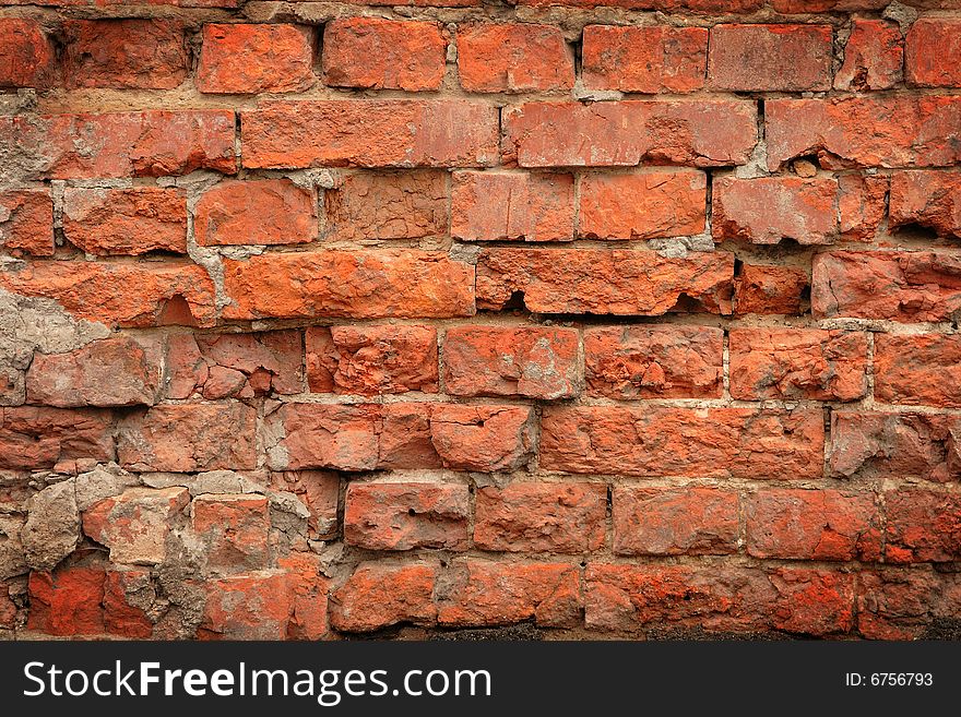 Damaged brick wall can serve as background. Damaged brick wall can serve as background