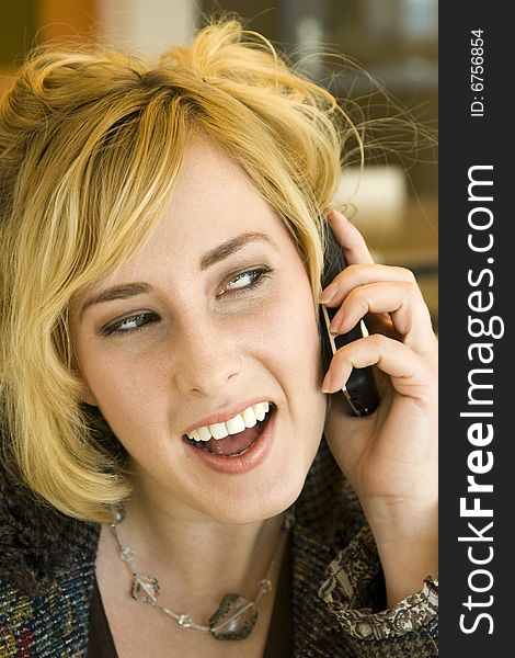 Young Blonde Caucasian Woman Talking on Mobile Phone. Young Blonde Caucasian Woman Talking on Mobile Phone