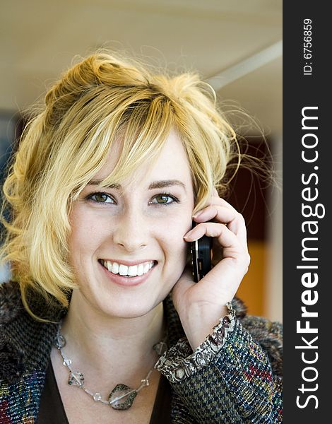 Young Blonde Caucasian Woman Answering Phone