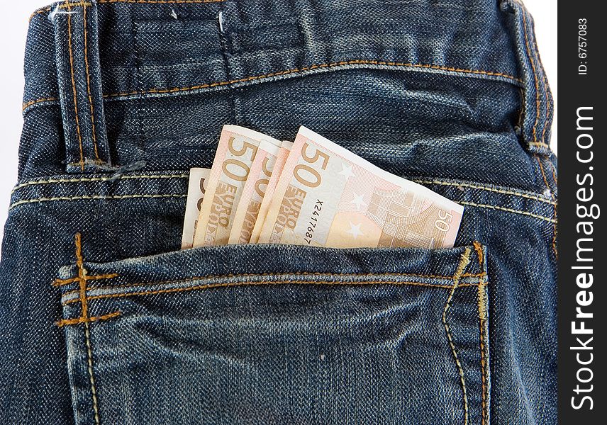 Bunch of Euro banknotes in the back pocket of a blue jeans.