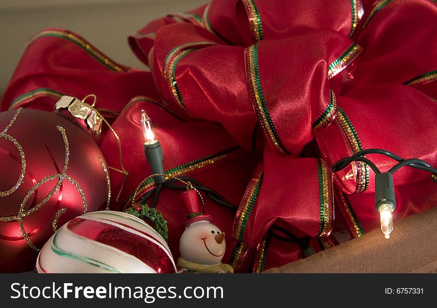 A basket full of christmas ribbon, lights and ornaments. A basket full of christmas ribbon, lights and ornaments