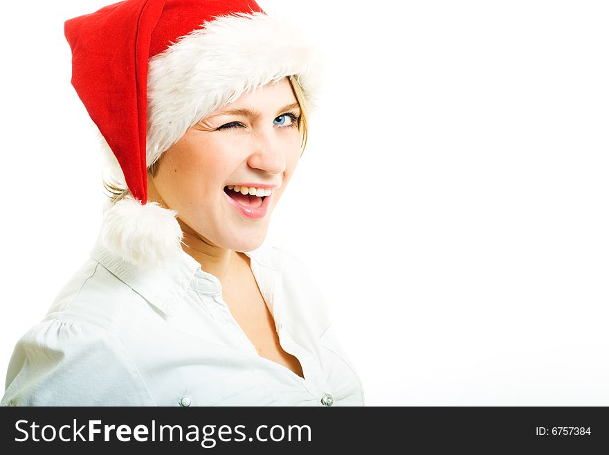 Girl in Santa hat looking at camera and wink. Girl in Santa hat looking at camera and wink.