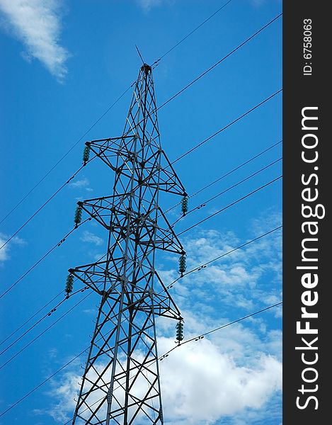 Electricity tower against the blue sky