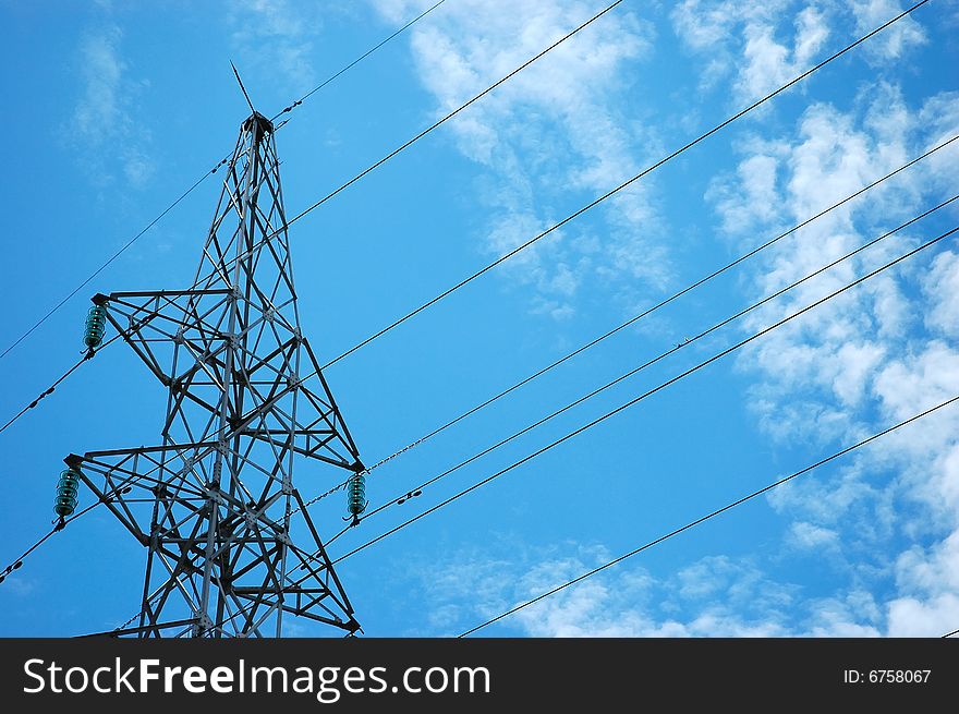 Electricity tower against the blue sky