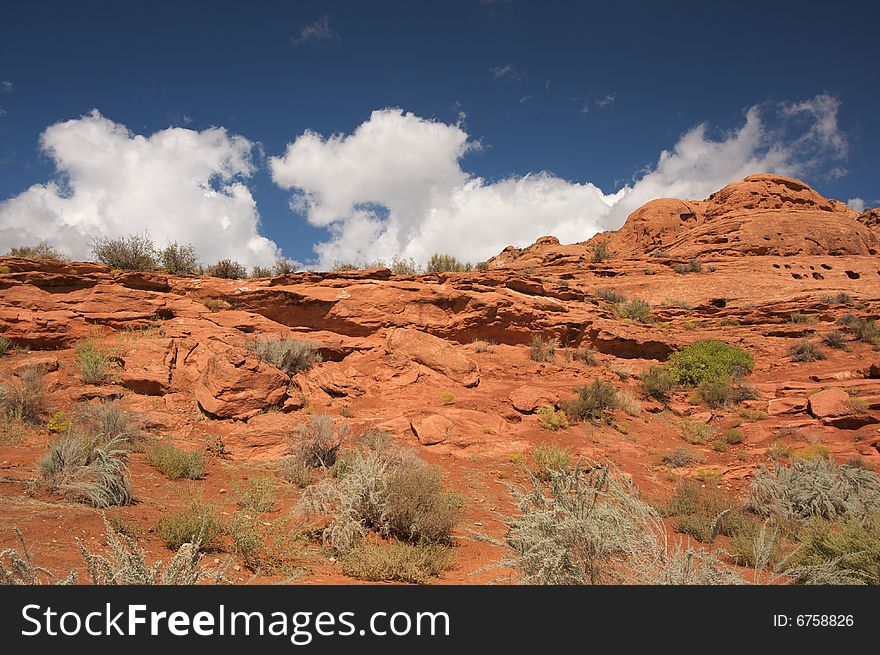 Red Rocks of Utah with Dramatic Blue Sky and Clouds