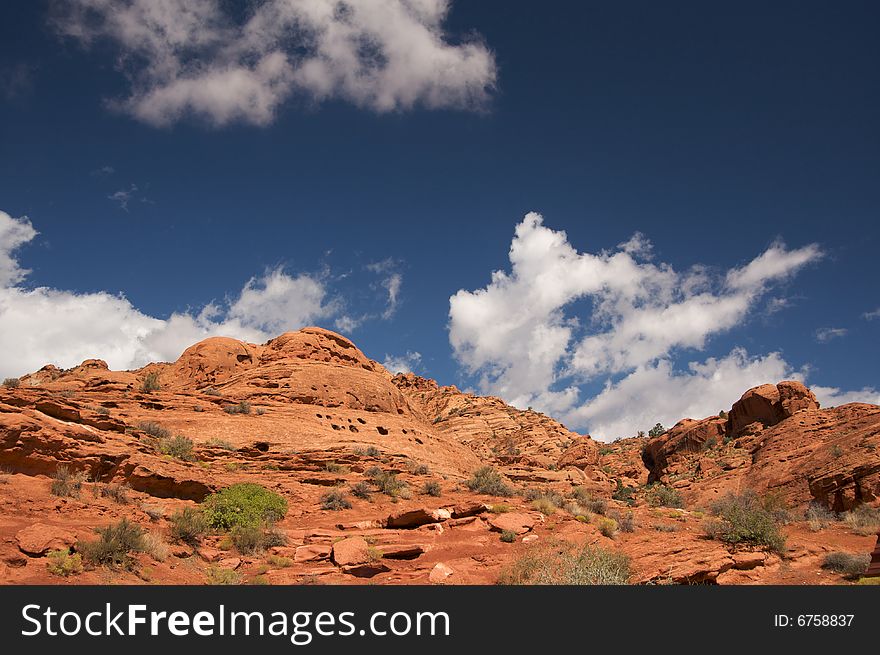 Red Rocks of Utah with Dramatic Blue Sky and Clouds