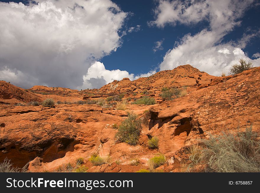 Red Rocks of Utah with Dramatic Blue Sky and Clouds