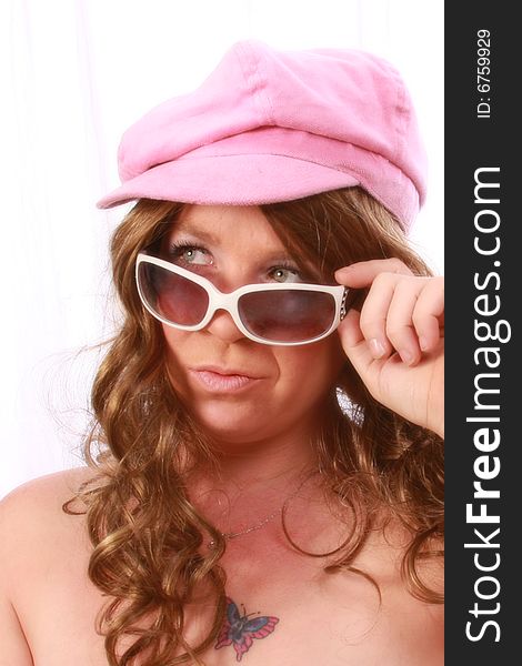 Women wearing a pink hat with sunglasses. Women wearing a pink hat with sunglasses