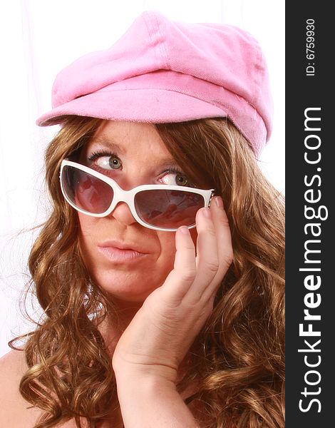 Women wearing a pink hat with sunglasses. Women wearing a pink hat with sunglasses