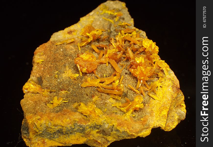 Orpiment a.ka. auripigment commonly occurs in hydrothermal veins of low temperatures. One of the basic ores of arsenium