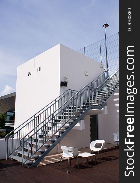 Bar opened on top of building roof with steel chairs