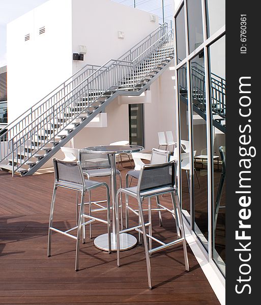 Bar opened on top of building roof with steel chairs