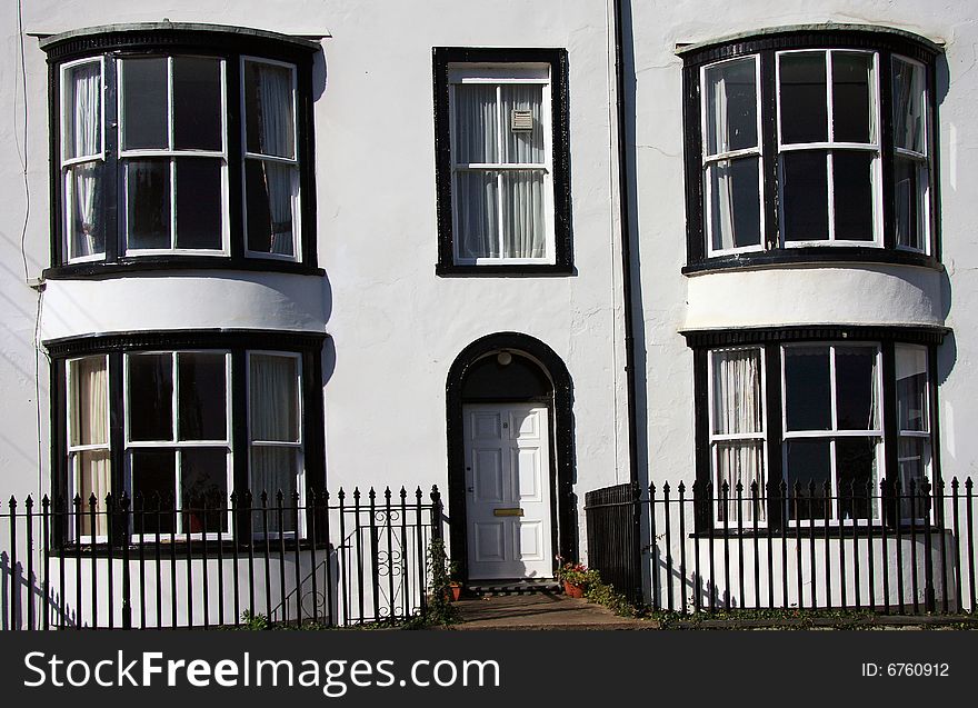 Black and white regency period terrace row housing at Seaton in Devon England. Black and white regency period terrace row housing at Seaton in Devon England