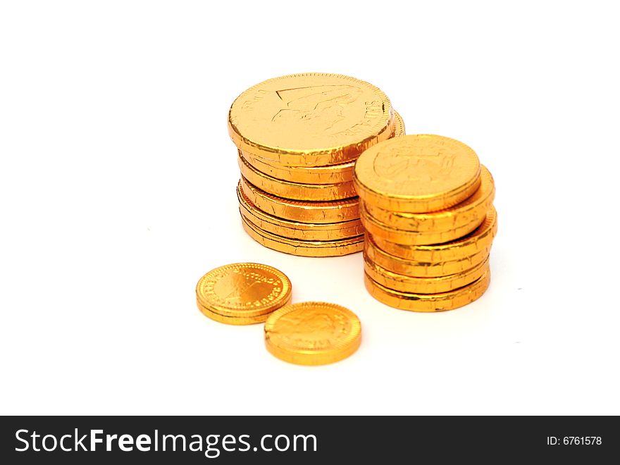 Shot of some chocolate coins on white