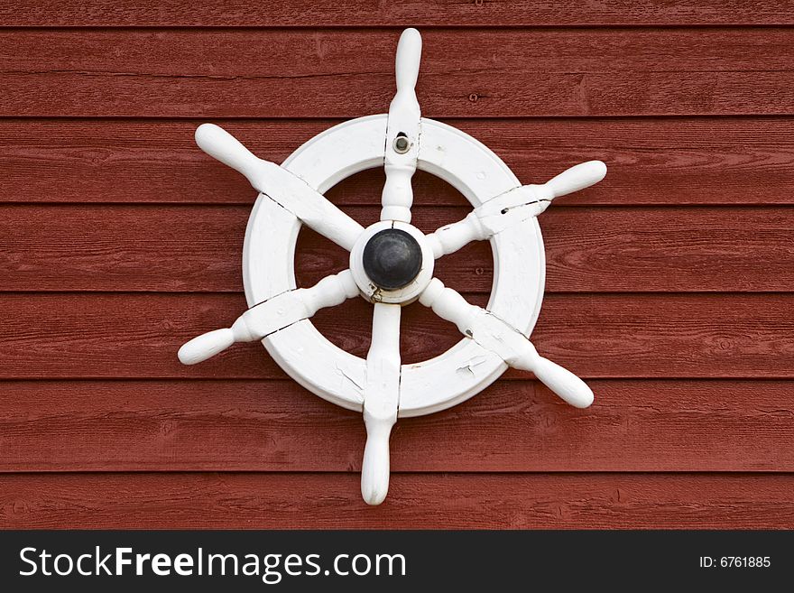 White control wheel to the decoration at a red house