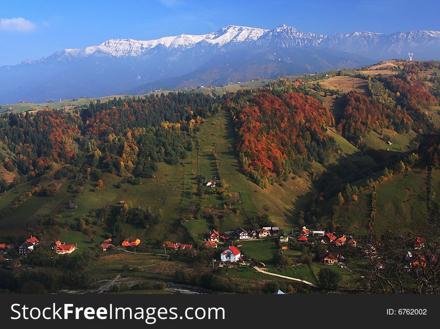 Bucegi Mountains seen from Moeciu in a beautiful autumn day