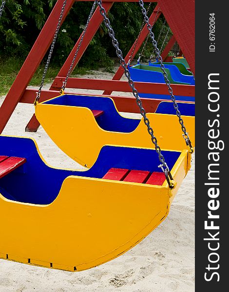 Colored swing on a playground for children