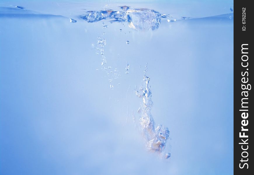 Close-up of water waving and splashing caused by dropping objects (you can add your own objects to the background so it appears to just falling down into water). Close-up of water waving and splashing caused by dropping objects (you can add your own objects to the background so it appears to just falling down into water)