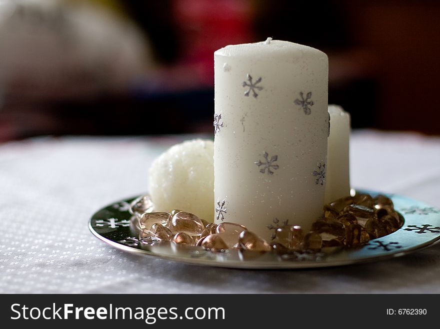 White christmas candles on table. White christmas candles on table