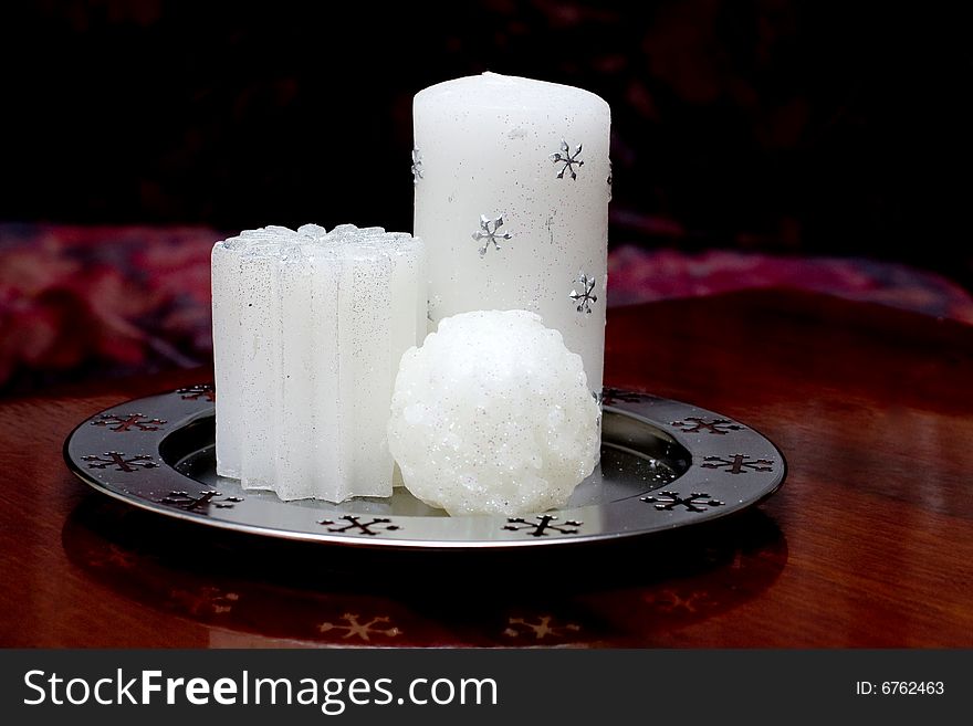 Perfect white candles with silver snowflakes. Perfect white candles with silver snowflakes