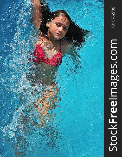 Top view of a girl swimming in pool. Top view of a girl swimming in pool