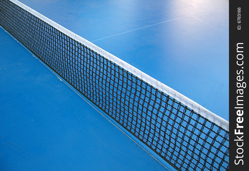 Table tennis net on sunny day